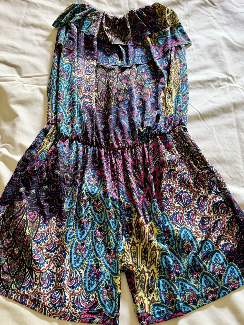 Bohemian-style strapless ruffle-top romper featuring colorful paisley